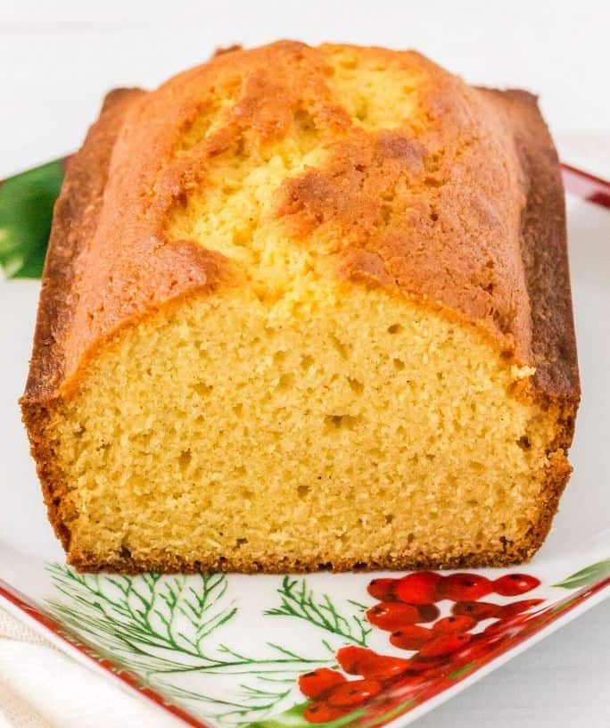 sliced loaf of eggnog bread on a Christmas platter