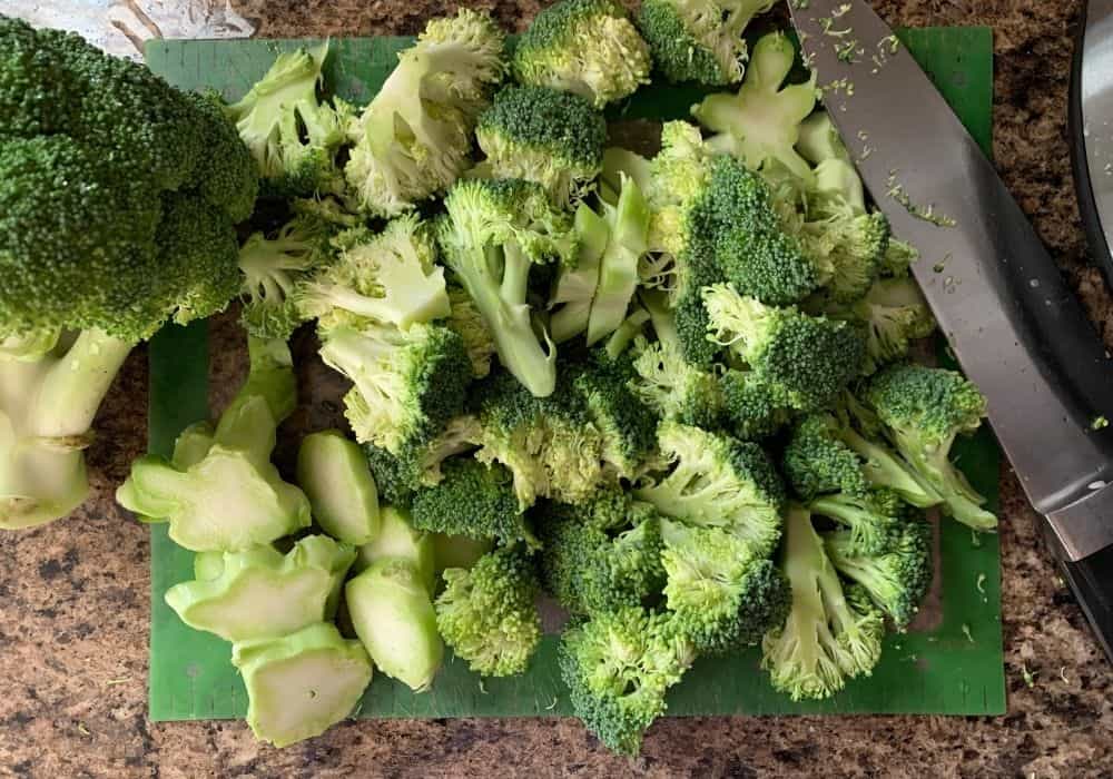 chopped florets and stems of broccoli for making vegan broccoli soup in the Instant Pot