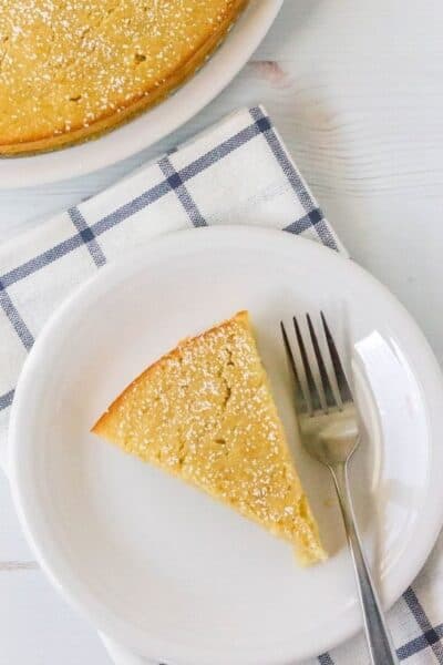 slice of fresh pear cake on a white plate