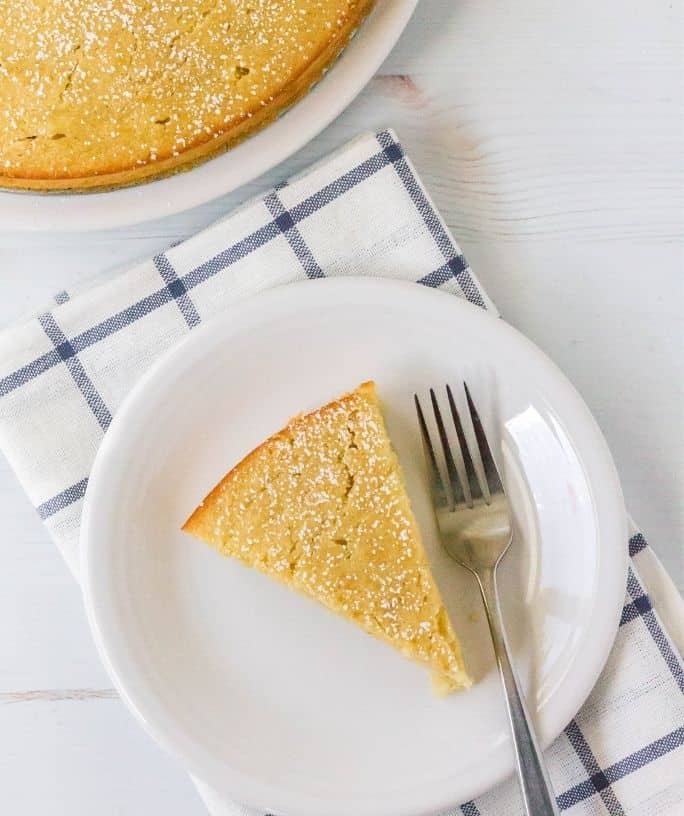 slice of fresh pear cake on a white plate