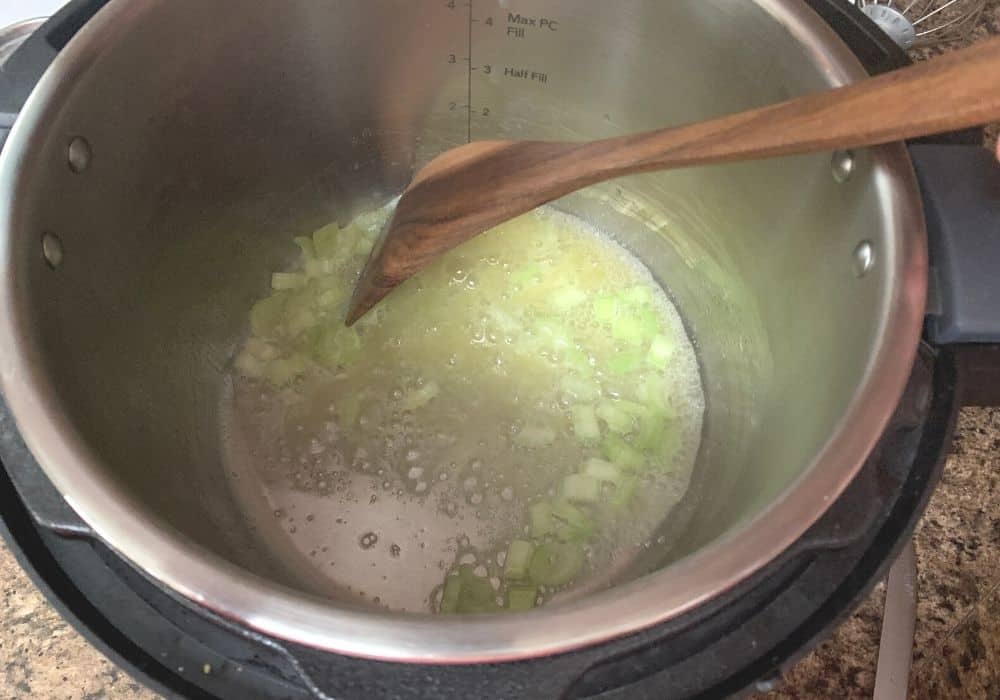 melted butter and celery in the Instant Pot 