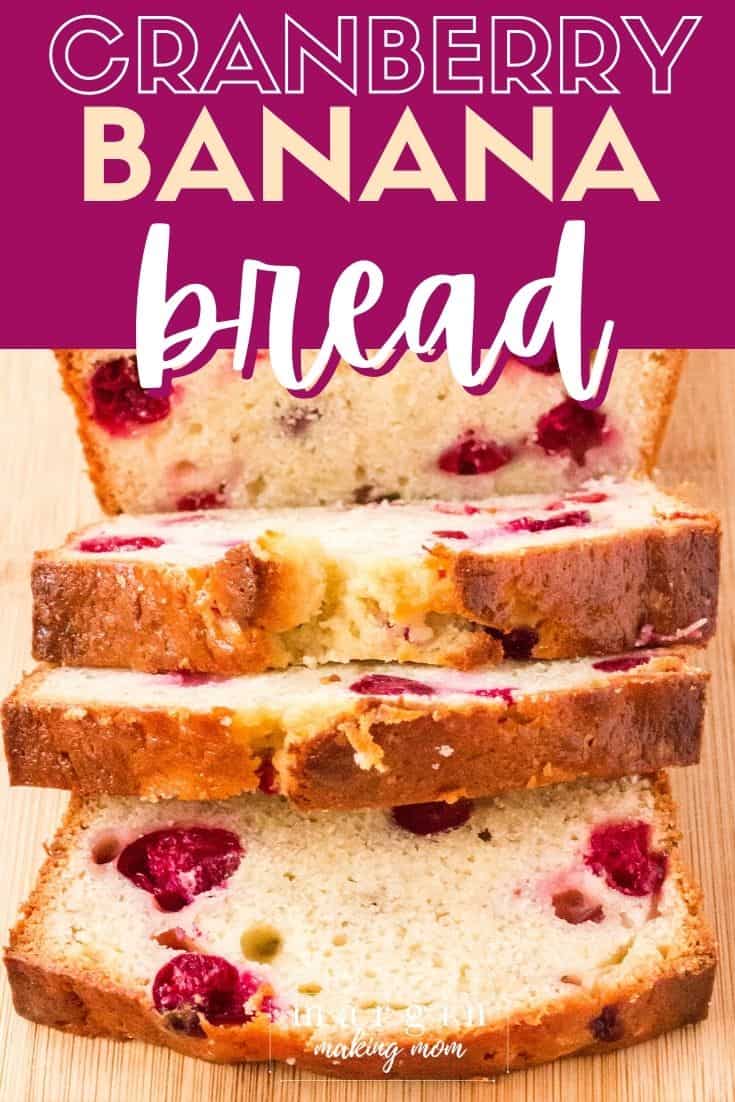 slices of cranberry banana bread rest on a wooden cutting board