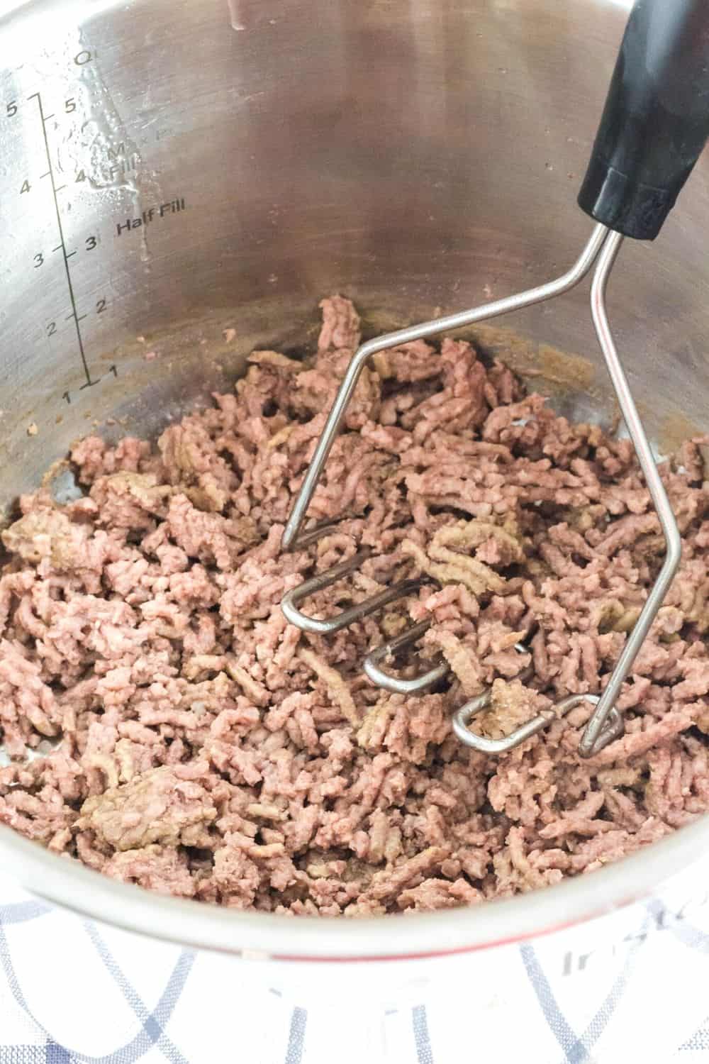 frozen ground beef that was cooked in the Instant Pot and crumbled using a potato masher