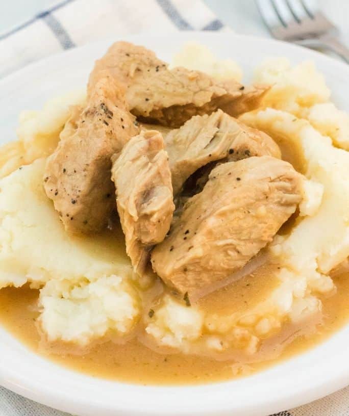 Instant Pot pork chops and gravy over mashed potatoes