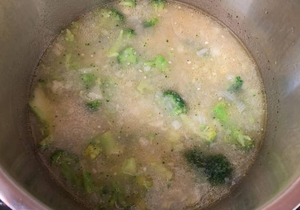 frozen broccoli added to the potato and broth mixture