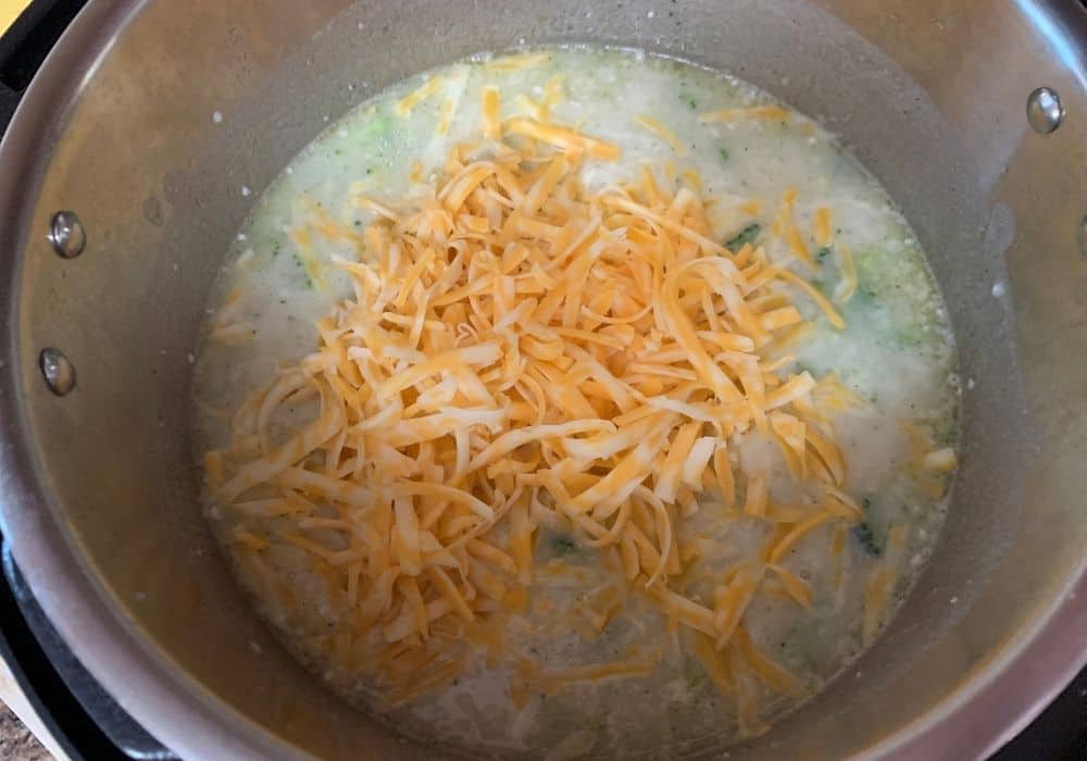 flour slurry and shredded cheese added to the soup