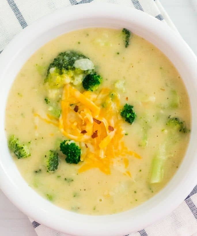 overhead view of a white bowl serving Instant Pot broccoli and potato soup