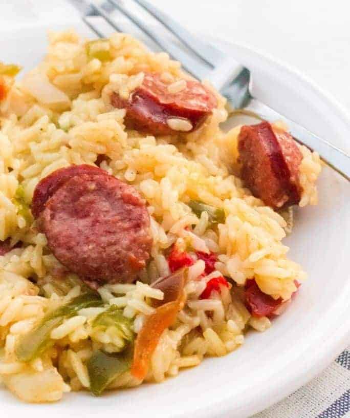 close-up view of Instant Pot sausage and rice on a white plate