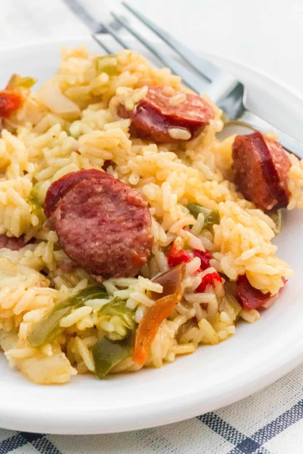 Pressure Cooker sausage and rice served on a white plate