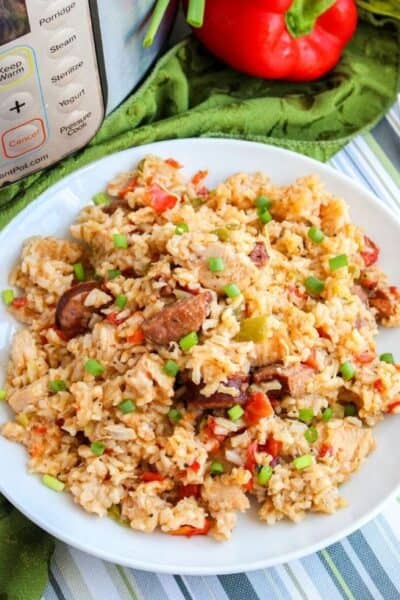 pressure cooker jambalaya of rice, sausage, and chicken served on a white plate