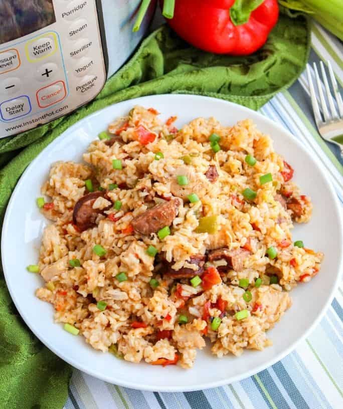 pressure cooker jambalaya of rice, sausage, and chicken served on a white plate
