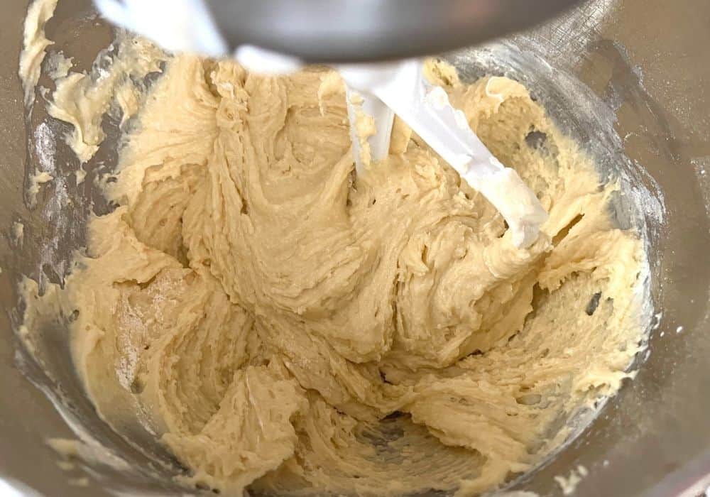 Dry ingredients and sour cream added to batter, creating a thick cake batter