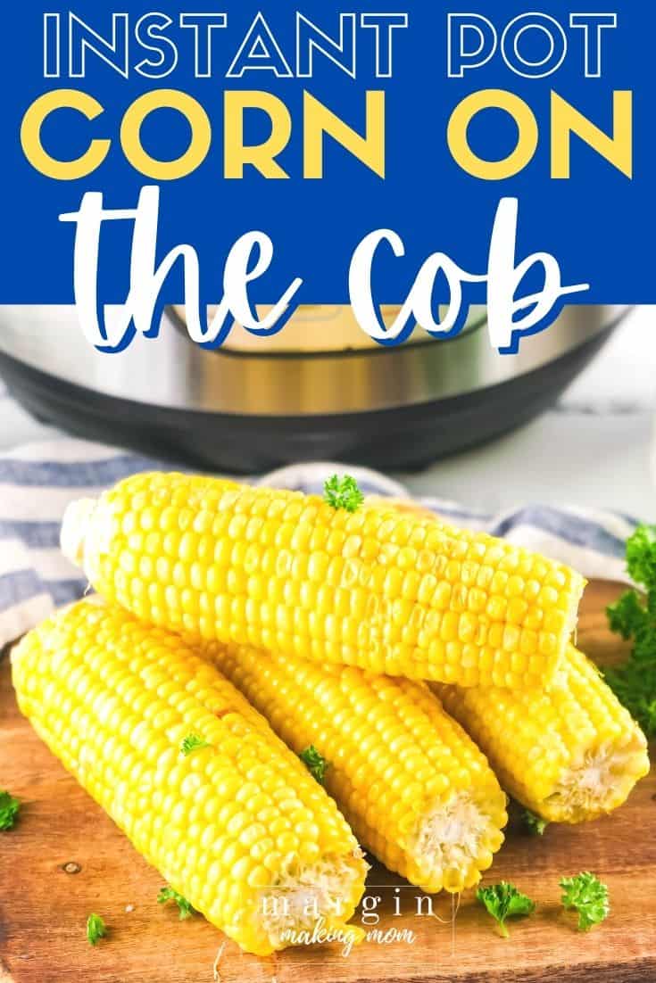 four ears of cooked corn on the cob on a cutting board in front of an Instant Pot pressure cooker