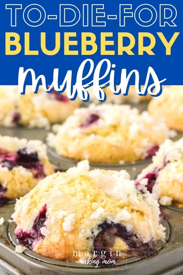 Side view of to die for blueberry muffins in a muffin pan, each topped with streusel