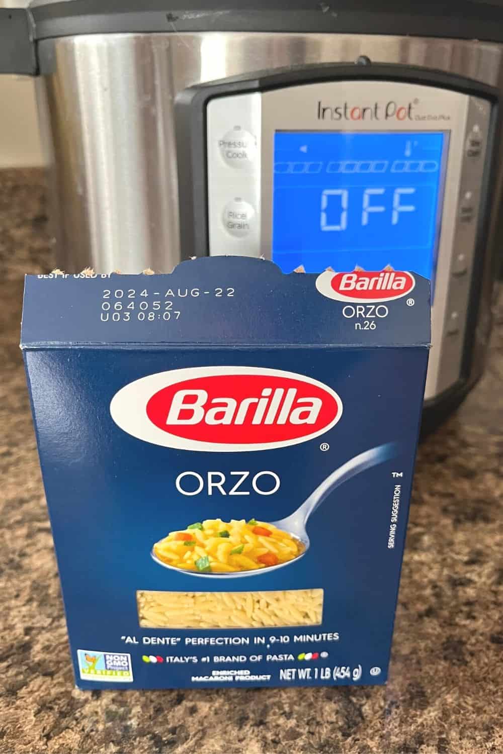 a box of Barilla orzo pasta in front of the Instant Pot electric pressure cooker