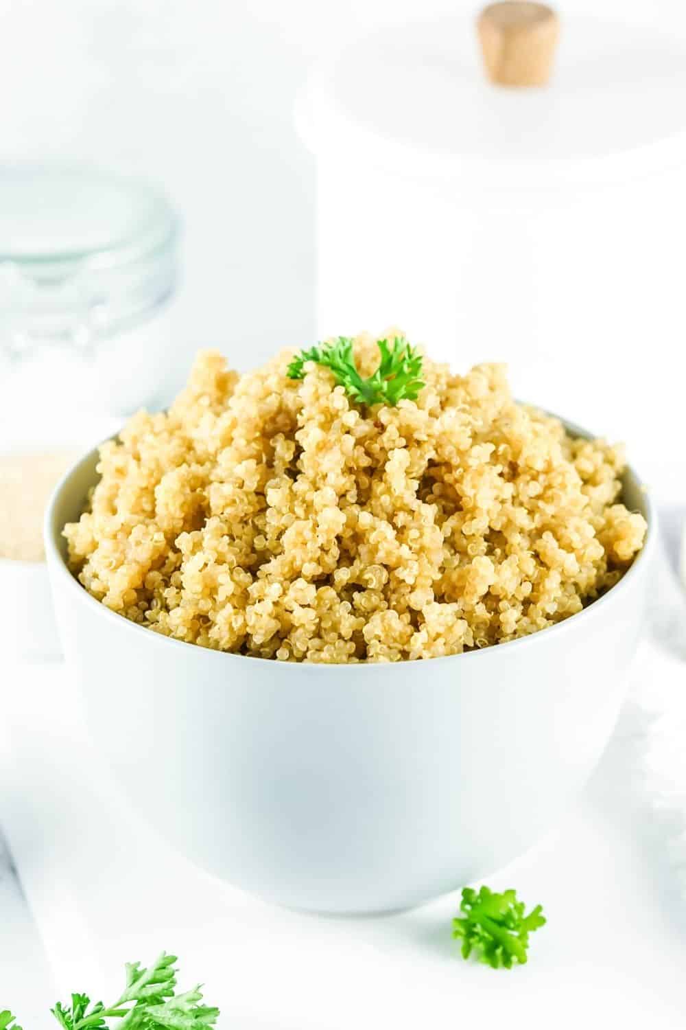 white bowl filled with quinoa cooked in the Instant Pot