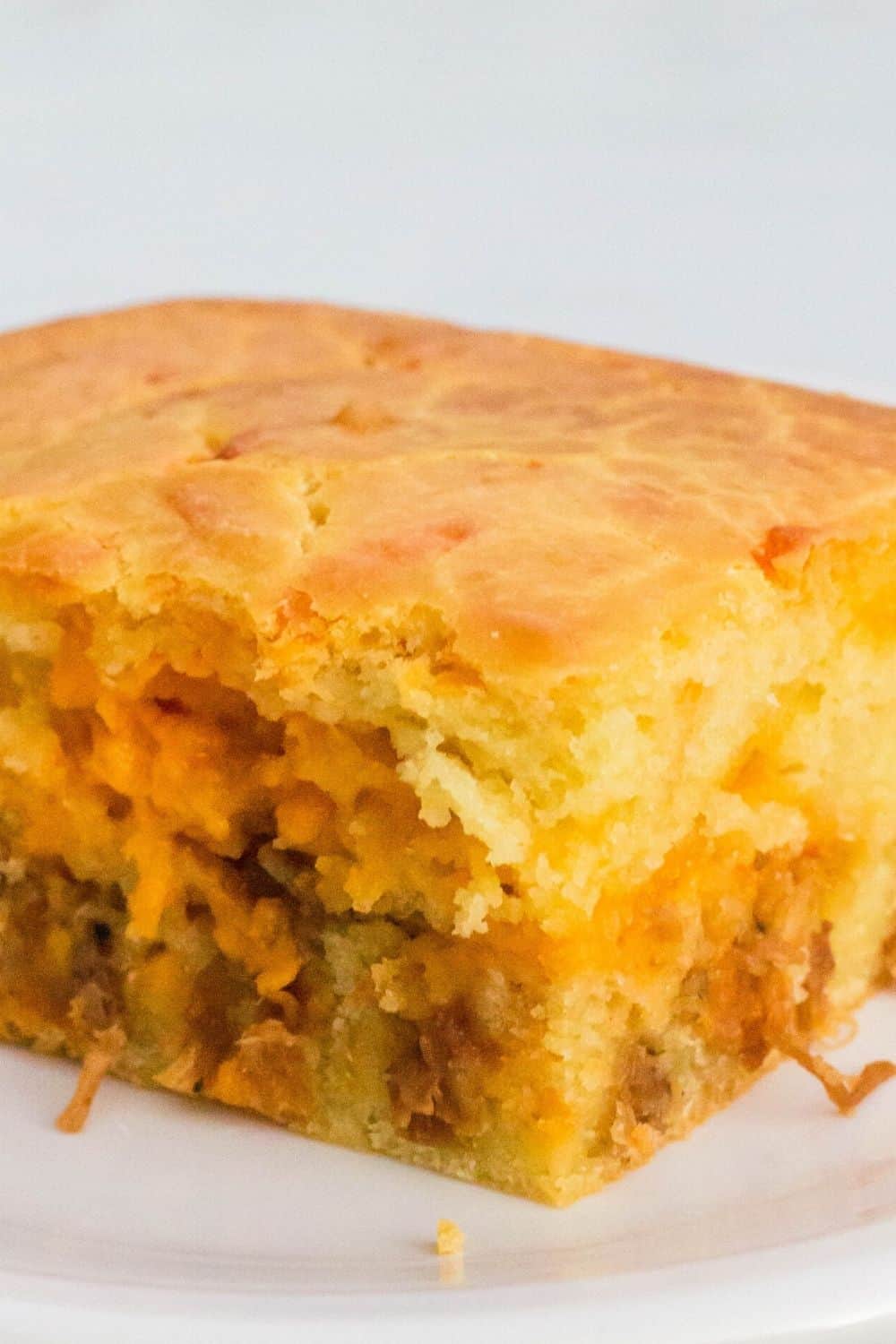 close-up view of a slice of bola de carne, a portuguese bread stuffed with meat and cheese
