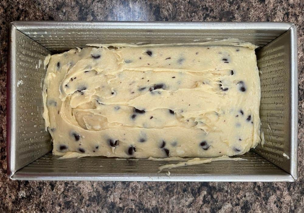 batter for chocolate chip cake in a loaf pan