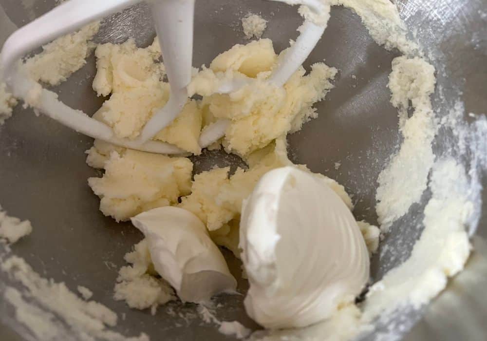 sour cream added to the butter and sugar in the stand mixer bowl