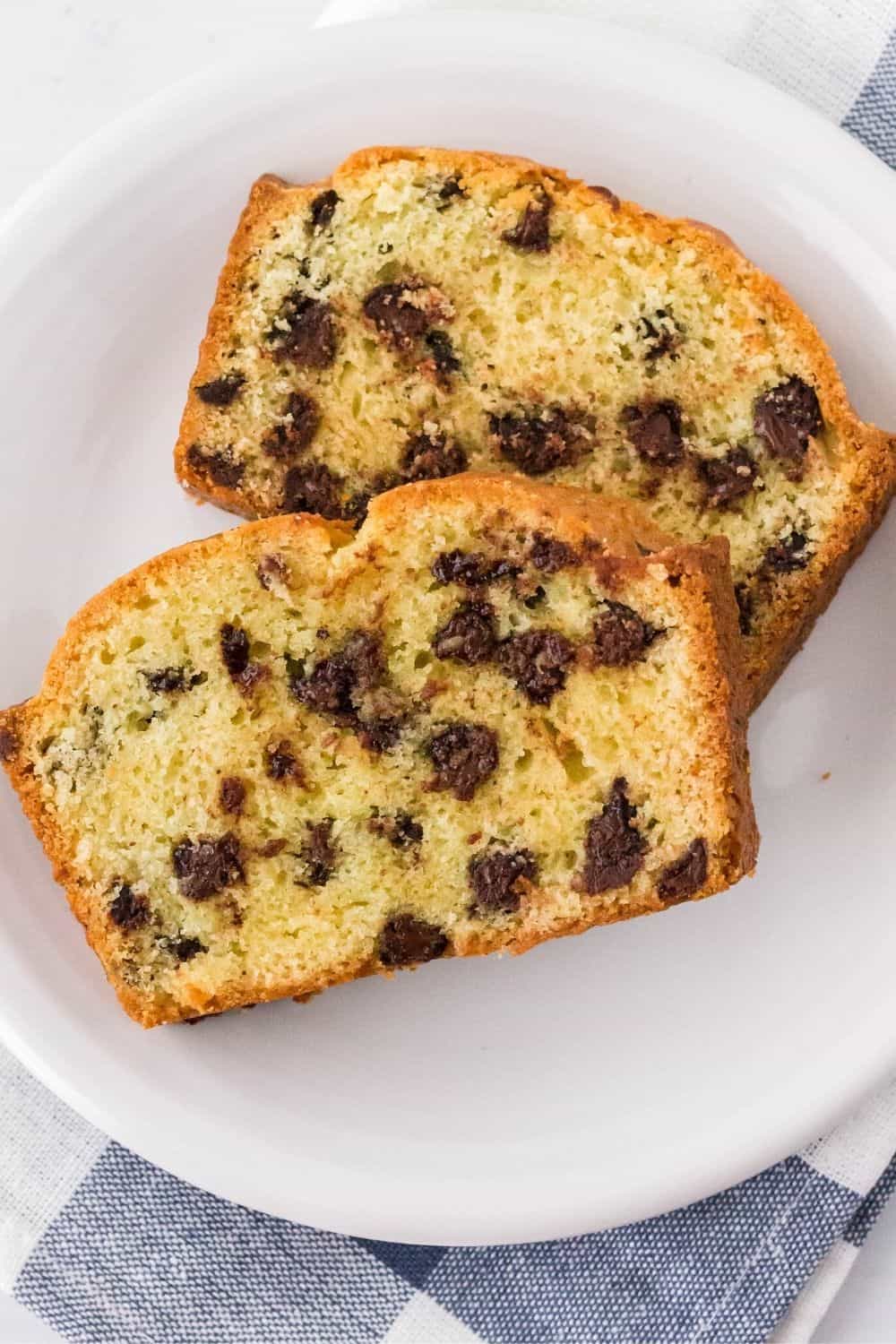 two slices of chocolate chip quickbread served on a white plate