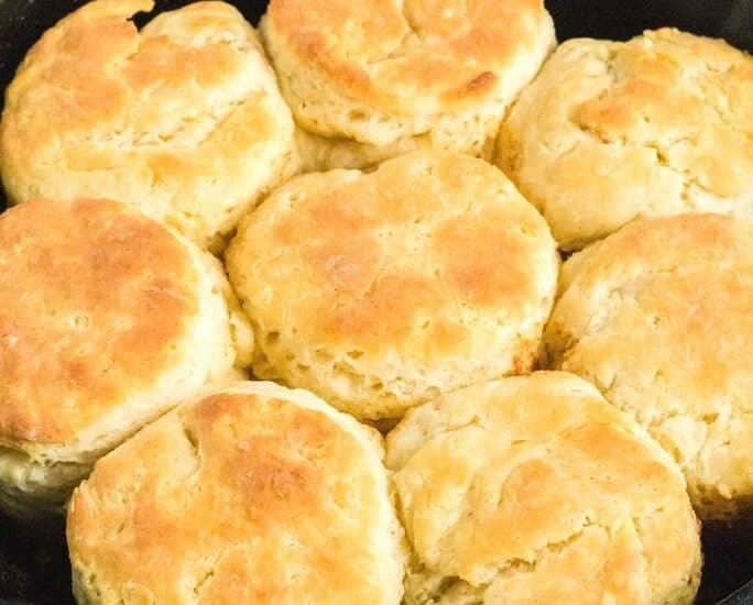 close-up view of freshly baked homemade biscuits in a cast iron pan
