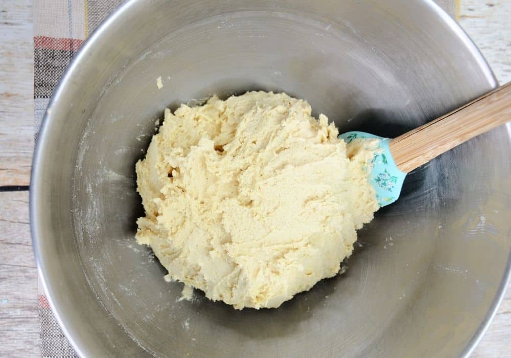pancake cookie dough in a mixing bowl with a spatula