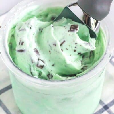 a pint of mint chocolate chip Ninja Creami ice cream with a scoop in it