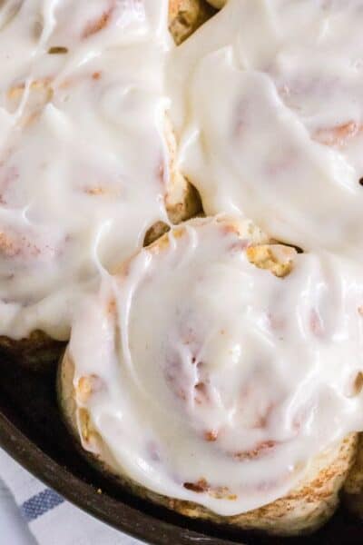 overhead view of frosted homemade quick cinnamon rolls