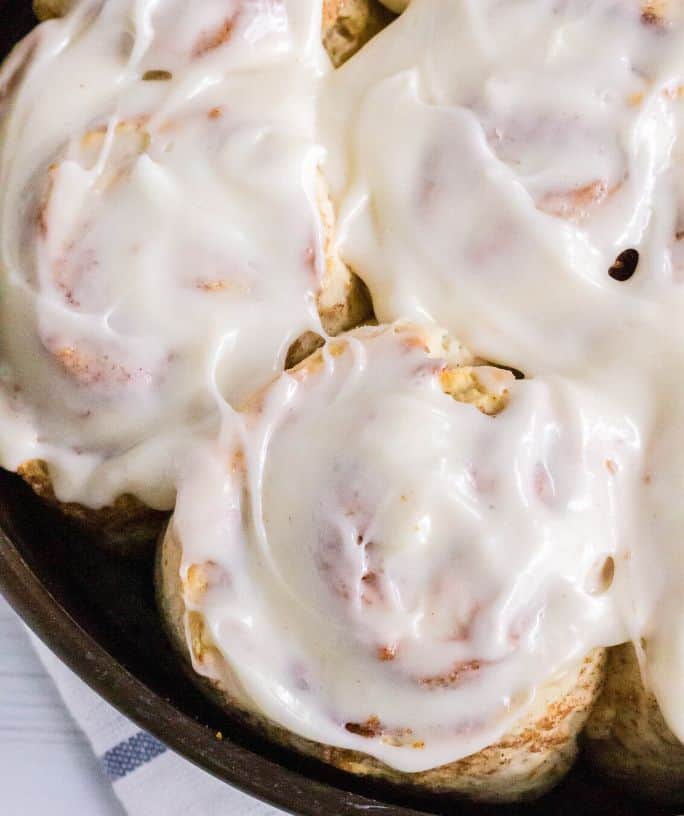 overhead view of frosted homemade quick cinnamon rolls
