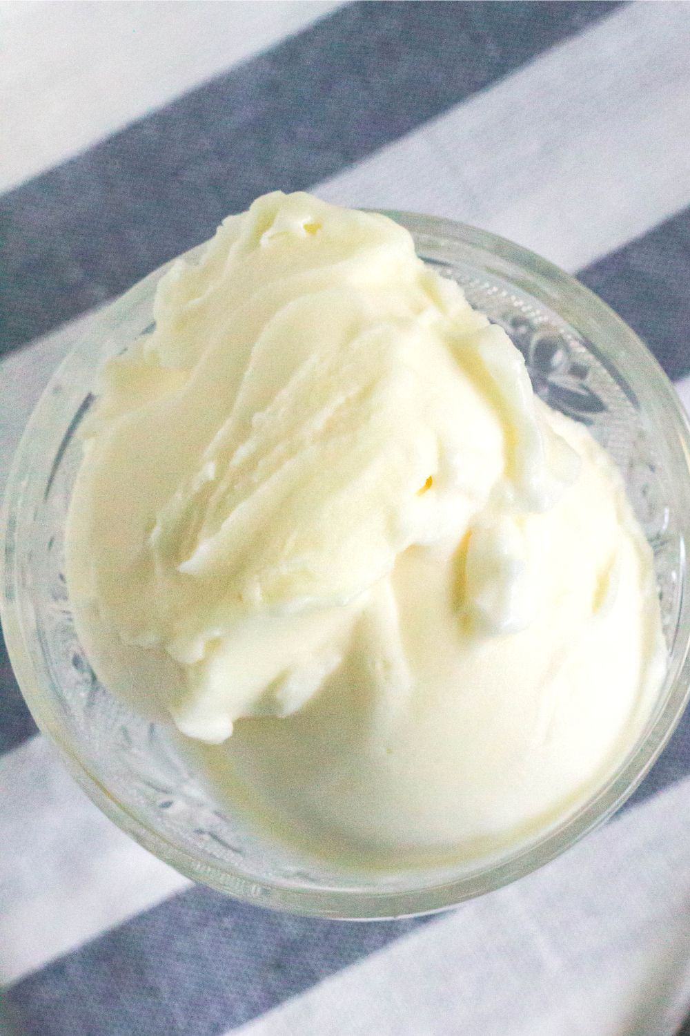 overhead view of two scoops of pineapple sorbet that were made in the ninja creami