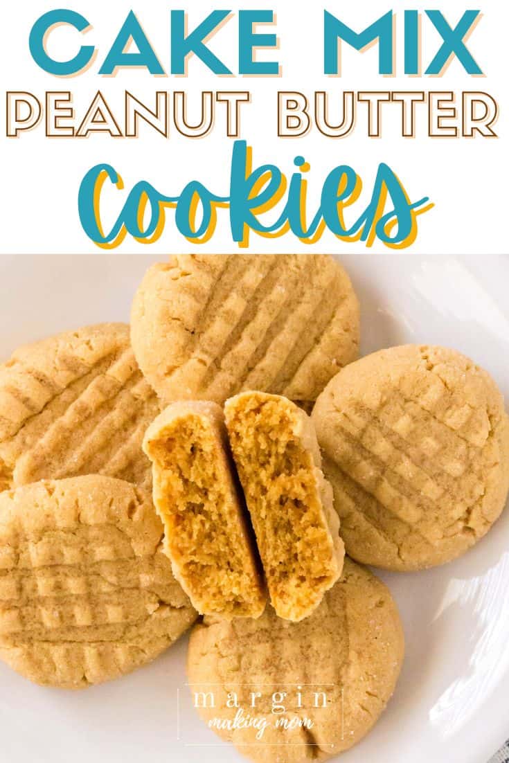 a plate of cake mix peanut butter cookies, with one cookie broken in half to show its soft and tender interior