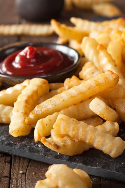 air fryer frozen crinkle fries that have been baked and are served with ketchup