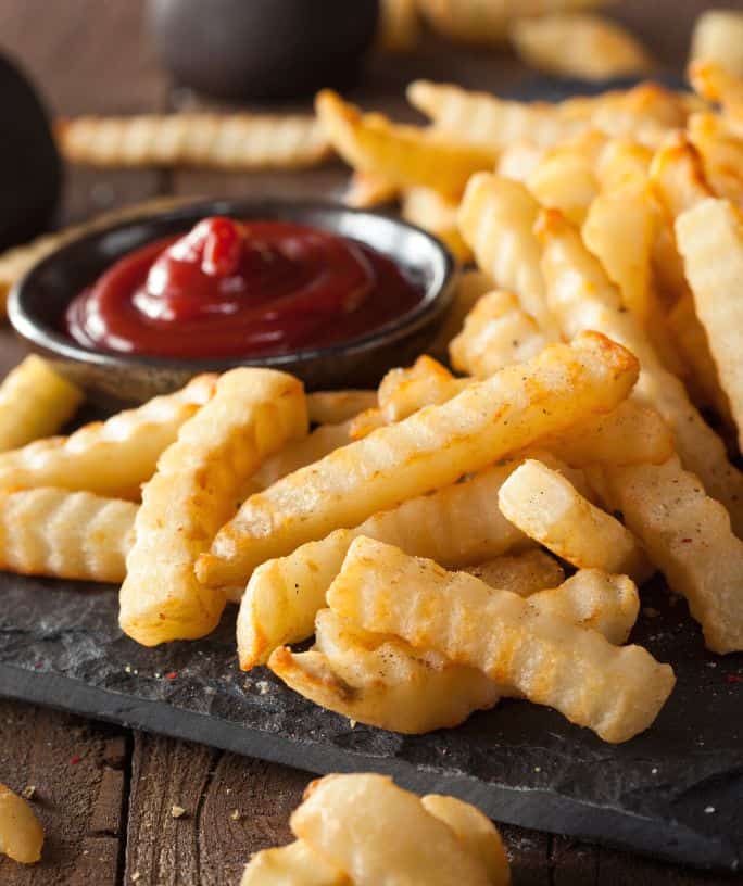 air fryer frozen crinkle fries that have been baked and are served with ketchup
