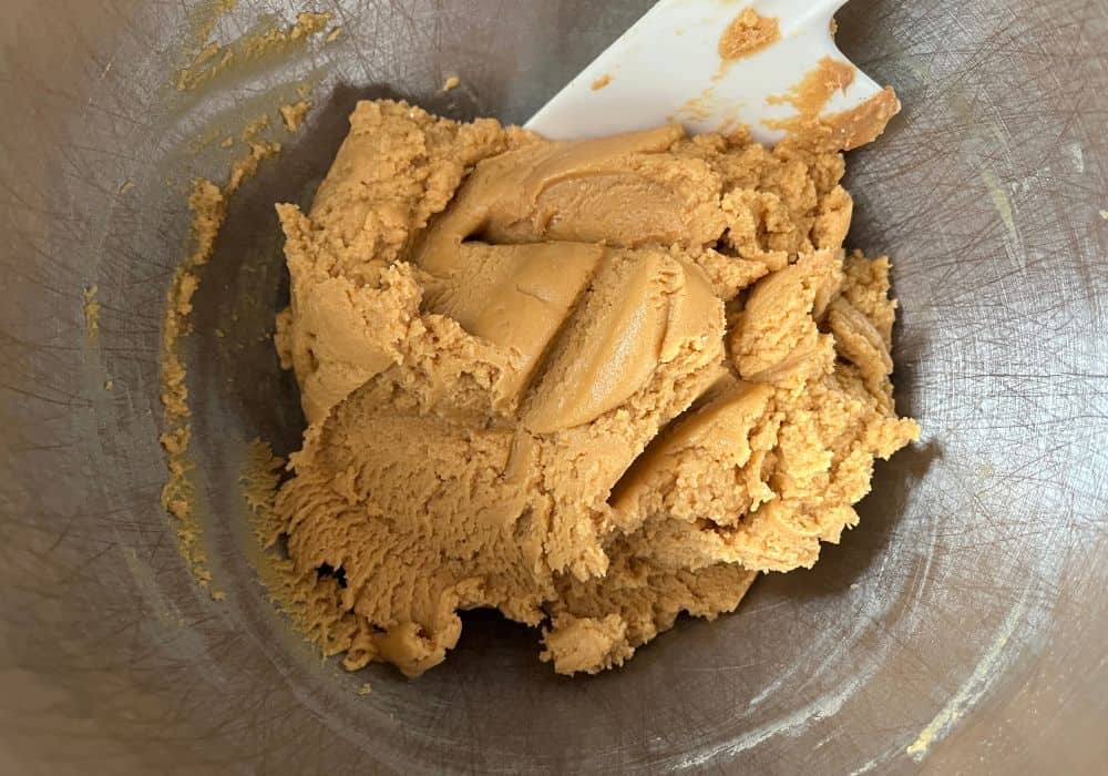 peanut butter cookie dough made from cake mix, in the mixing bowl ready for shaping.