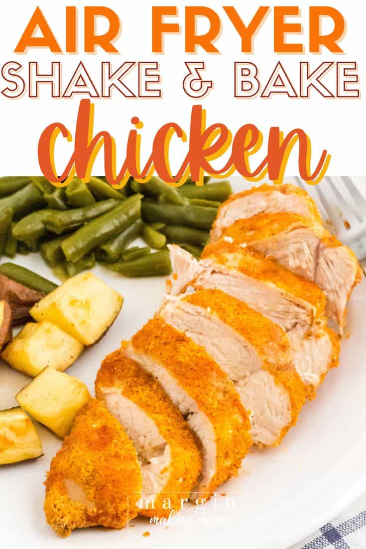 sliced shake and bake chicken breast that was cooked in the air fryer, served on a white plate with green beans and roasted potatoes