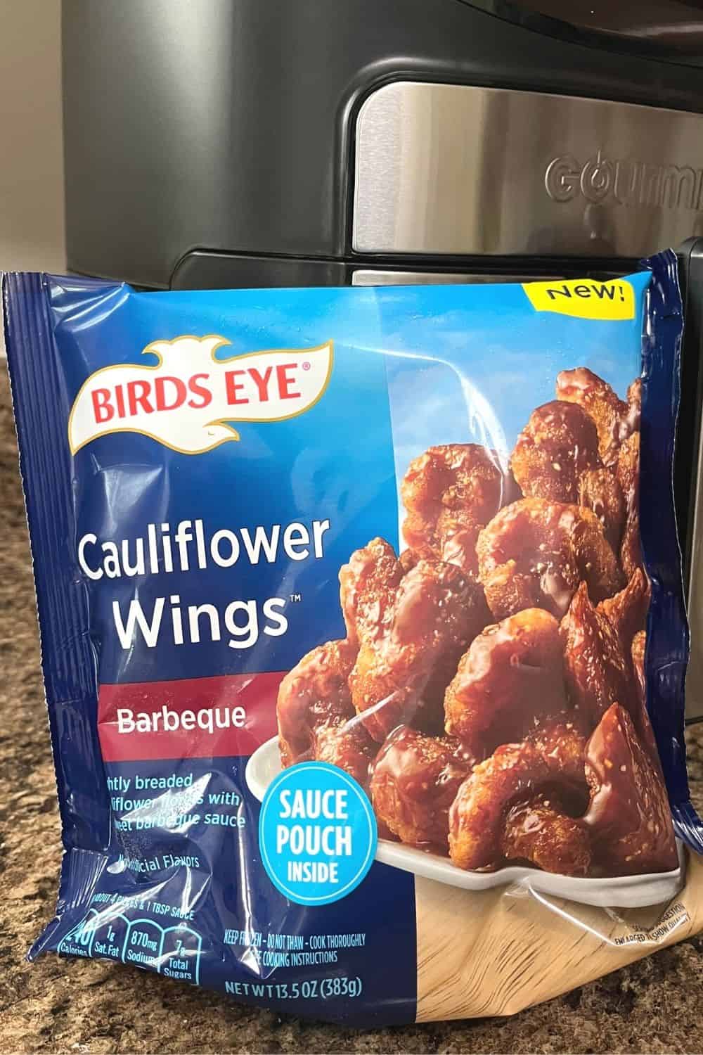 package of Birdseye frozen cauliflower wings in front of a Gourmia air fryer