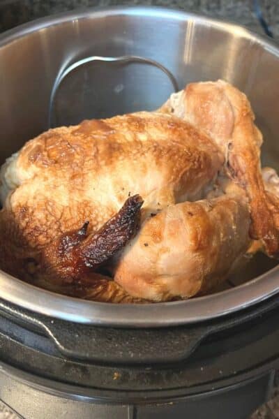 rotisserie chicken being reheated in the instant pot