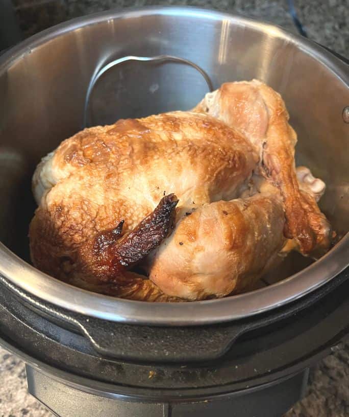 rotisserie chicken being reheated in the instant pot