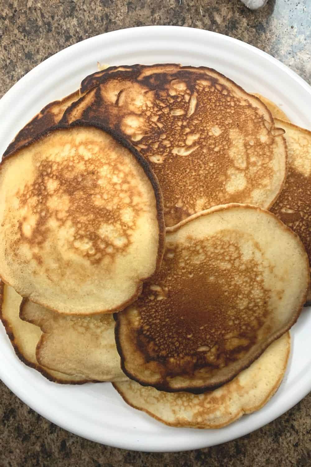 white plate with several fluffy pancakes made with self-rising flour on it