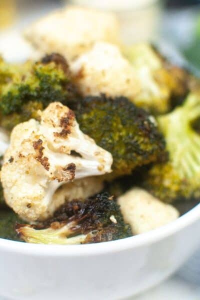 air fryer broccoli and cauliflower in a white bowl