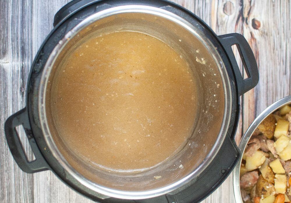 cooking liquid being simmered into gravy in the instant pot