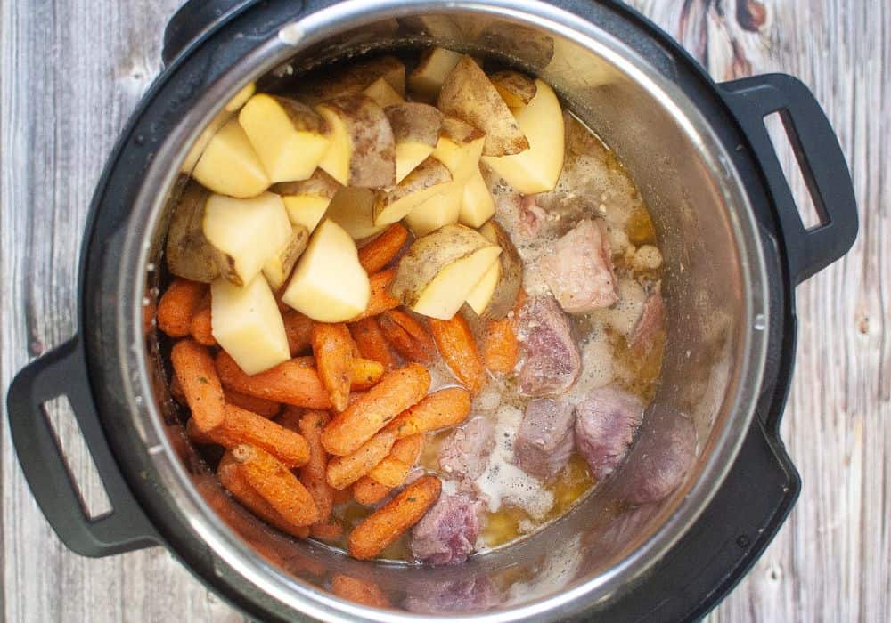 potatoes, carrots, and pork roast pieces added to instant pot