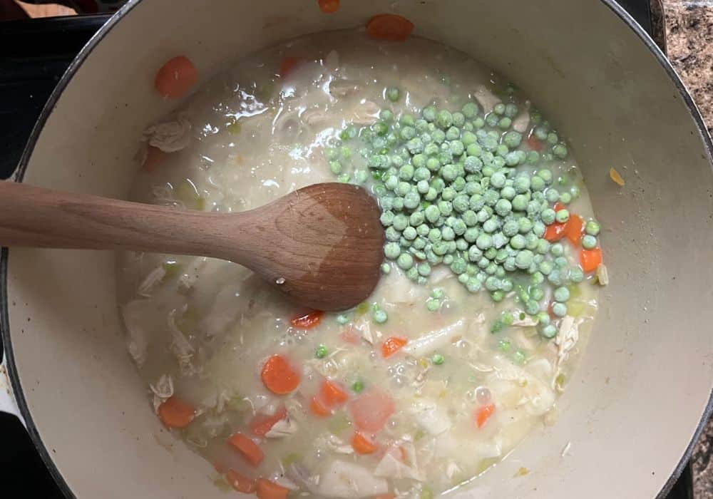 frozen peas added to chicken and dumpling mixture in the dutch oven