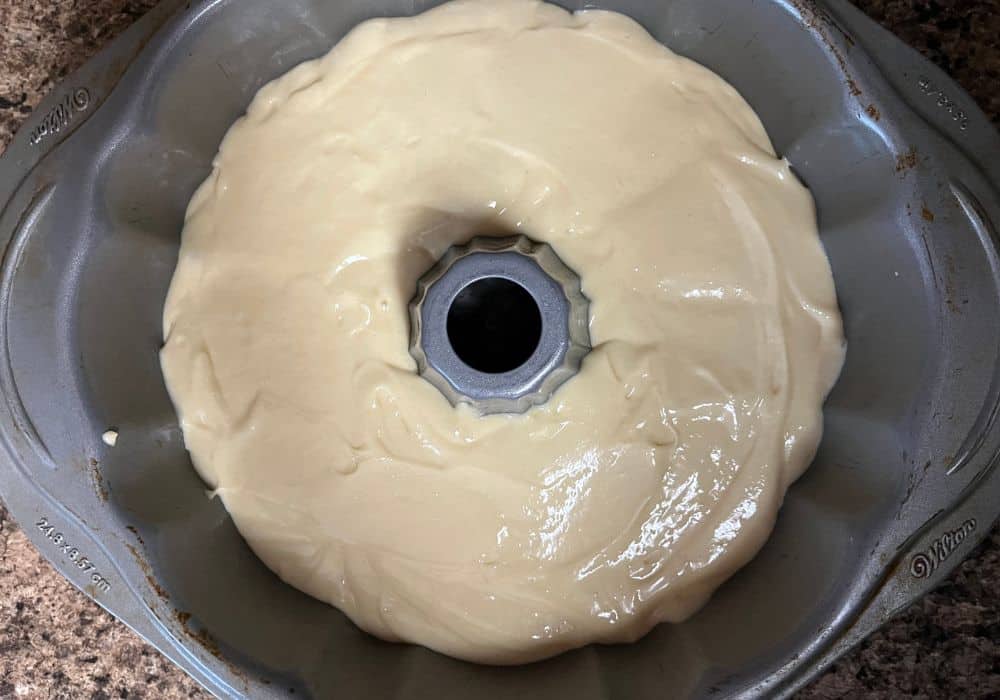 vanilla pudding cake batter added to prepared bundt pan