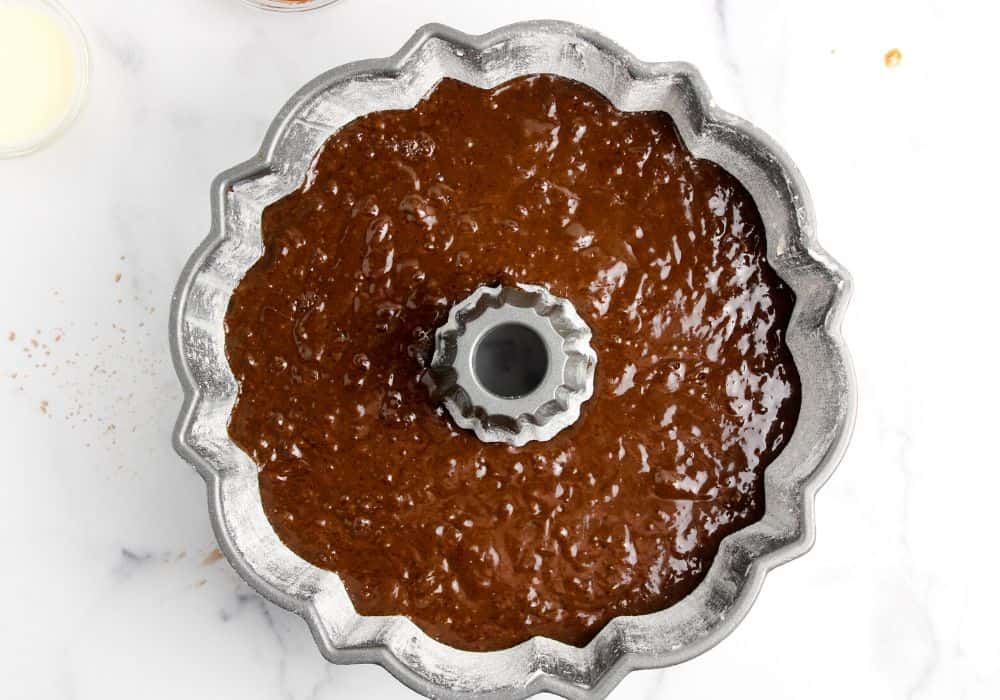 chocolate fudge cake batter in prepared pan, ready for baking