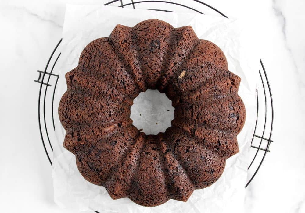 chocolate fudge bundt cake cooling on a wire rack