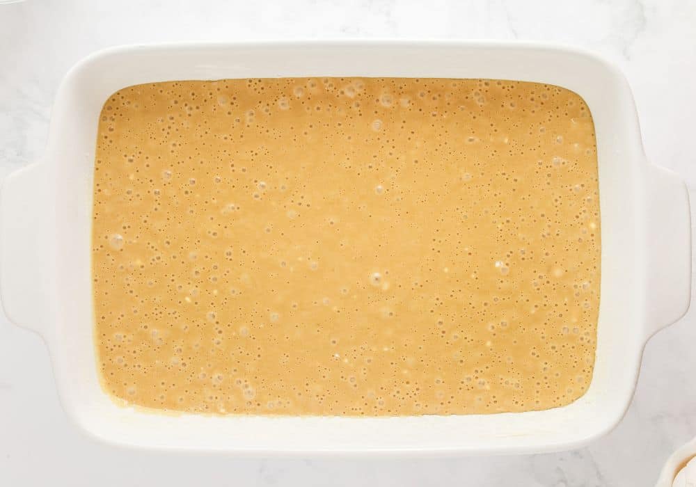butterscotch cake batter in a baking dish, ready to be baked