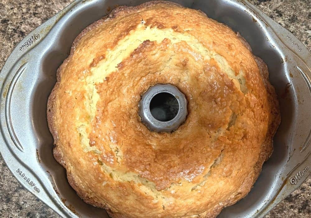 freshly baked pineapple pound cake still in the bundt pan