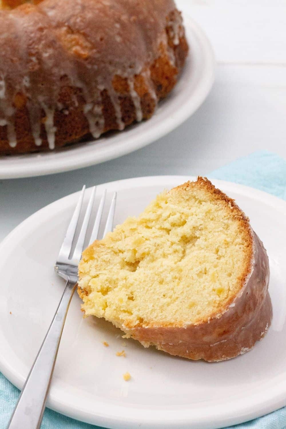 close-up view of a slice of pound cake made with pineapple, showing the moist interior.