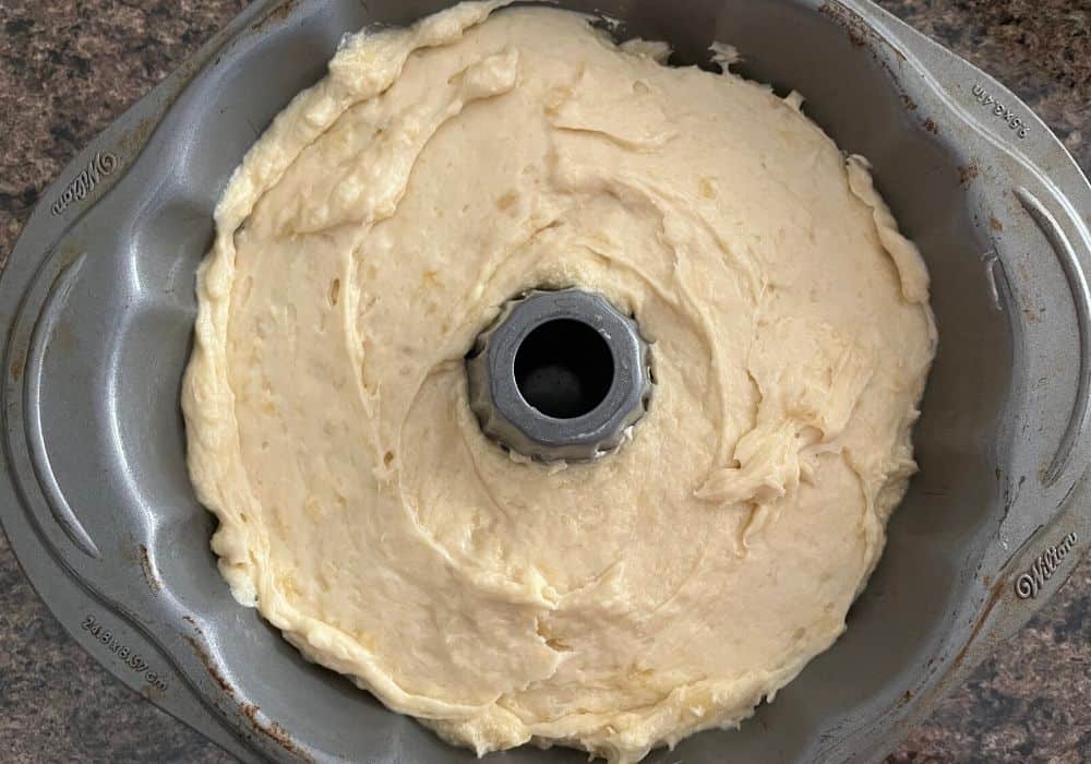 pineapple cake batter in a bundt pan, ready to be baked